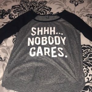 grey shirt with black sleeves